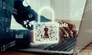 Businessman uses capable laptop computer to manage cyber security system